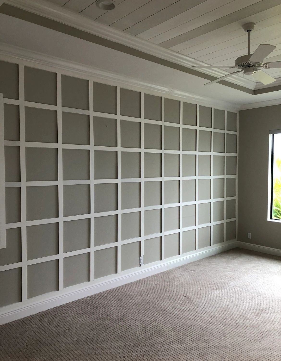Grid panel wall. A full-height grid in a primary bedroom.
