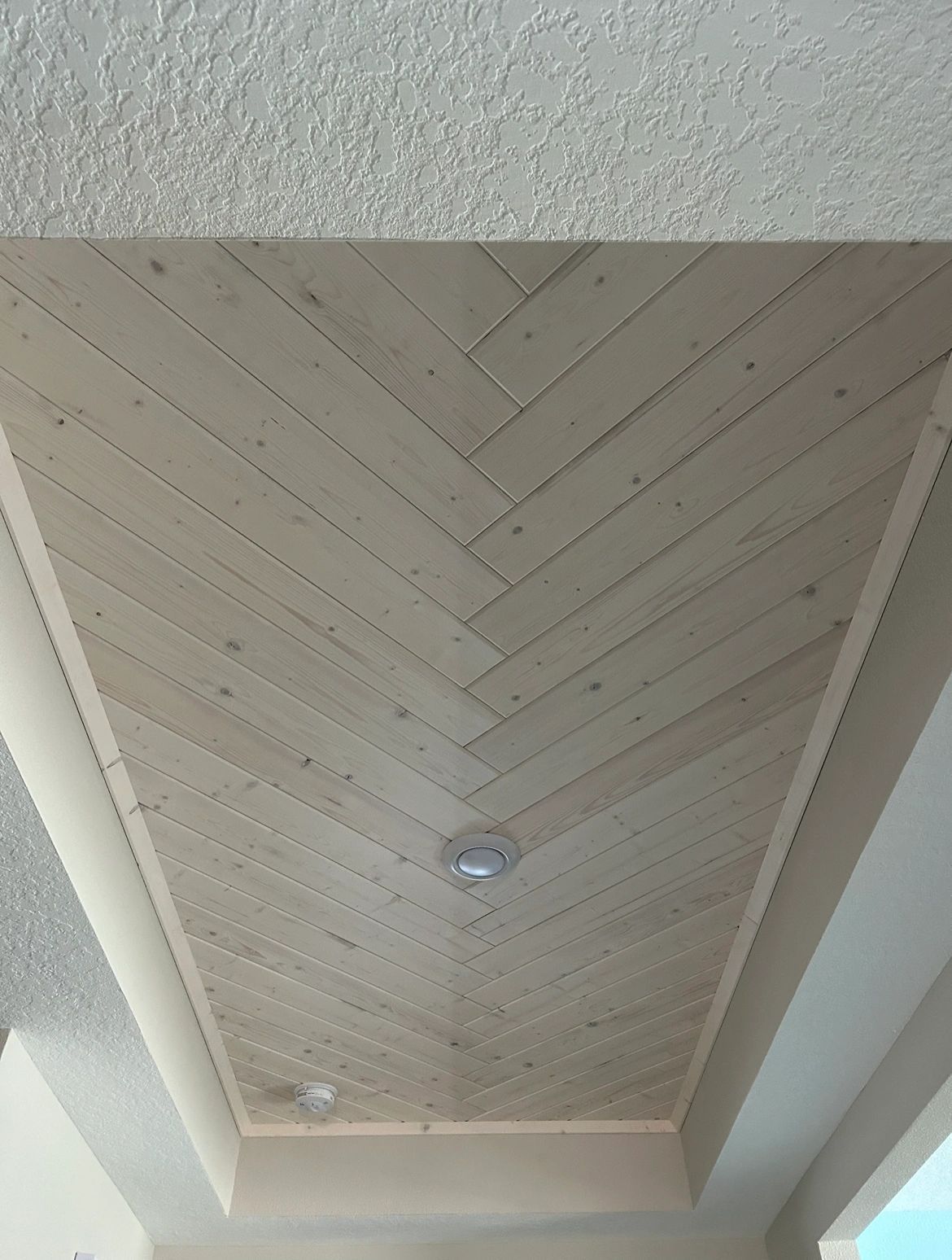 Herringbone ceiling. Tongue-and-groove laid in a herringbone.