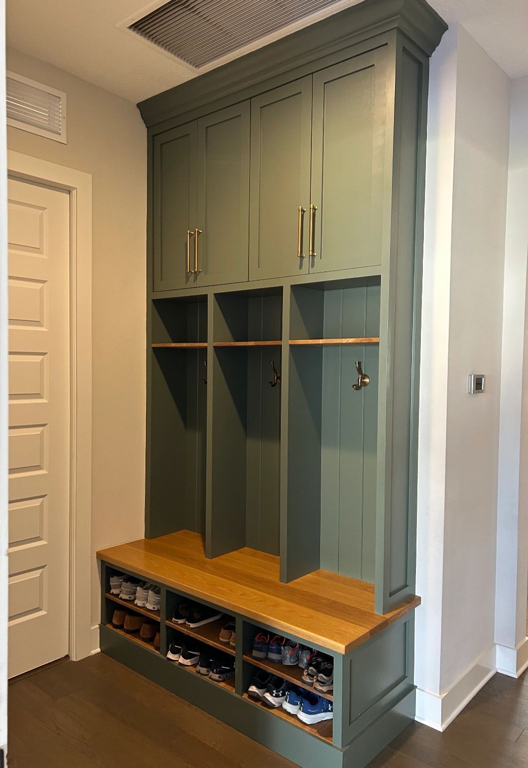 Mudroom lockers. Painted lockers with a wood bench and shoe cubbies.