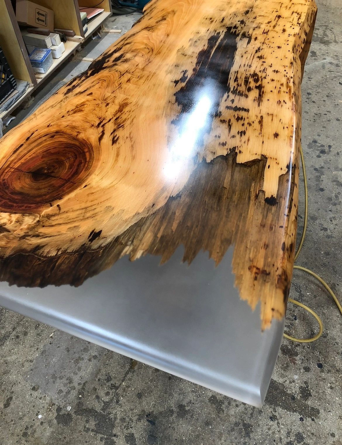 Spalted slab, clear resin. Spalted wood with a clear resin pour holding the broken edge.