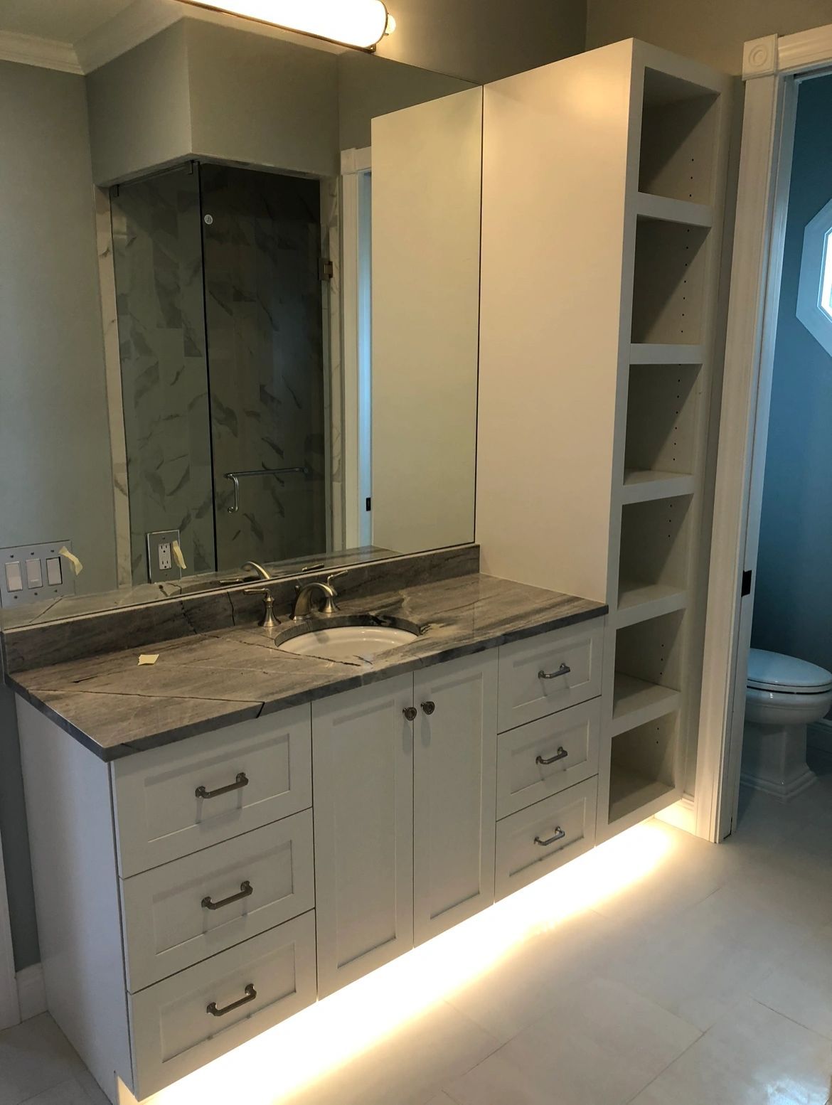 Vanity and linen tower. Matching vanity, tower and open shelves.