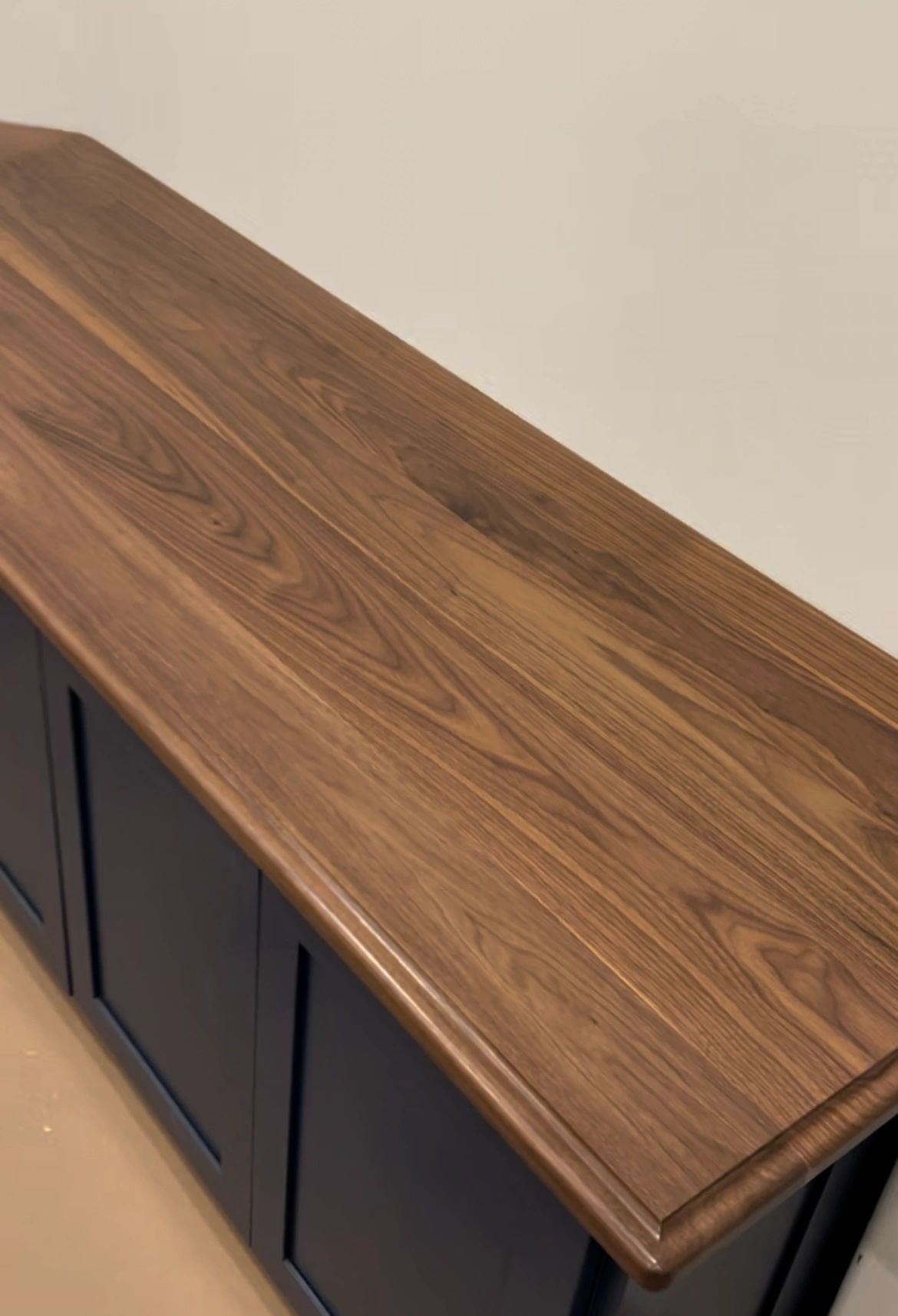 Edge profile. Hand-finished edge on solid walnut.